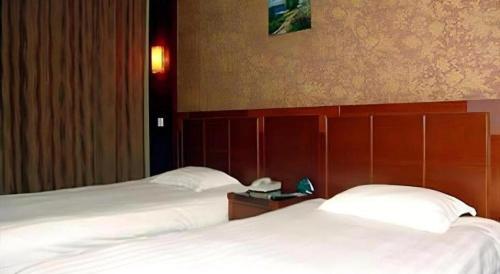 Letto o letti in una camera di GreenTree Inn Changshu South HaiYu Road Pedestrian Street Business Hotel