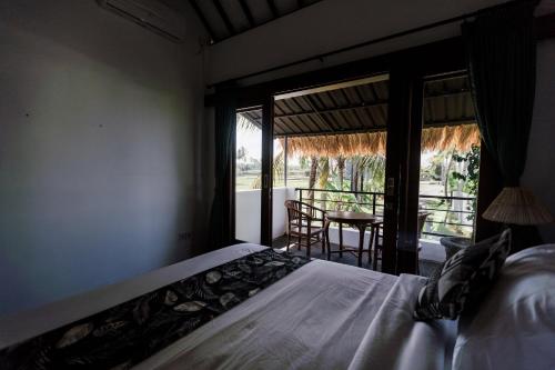 Postel nebo postele na pokoji v ubytování Sundhara View Ubud