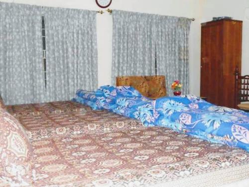 Katil atau katil-katil dalam bilik di Usman Guest House