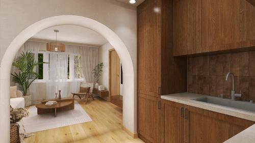 a kitchen with an archway leading to a living room at Vega House Luxury & Relax in Orşova