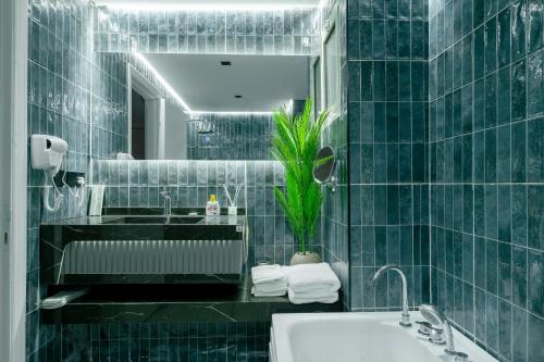 a bathroom with a sink and a mirror at Luxurious Olaya Residence in Riyadh