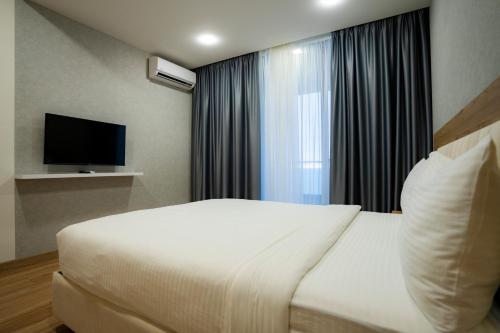 Solis Residence Aparthotelにあるテレビまたはエンターテインメントセンター