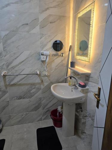 a bathroom with a sink and a mirror at Golden Tiba in Hurghada