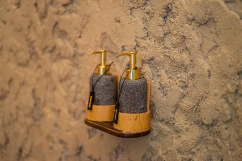 a pair of shoes hanging on a wall at Velonia Iseh in Sidemen