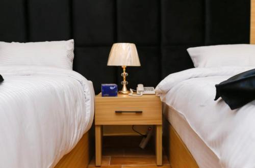 Кровать или кровати в номере Lumina Pyramids Inn