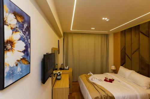 Телевизор и/или развлекательный центр в Lumina Pyramids Inn