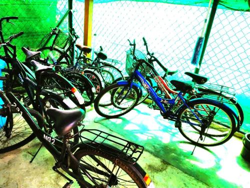 a group of bikes parked next to a fence at Sekinchan 231 VA Chalet in Sekincan
