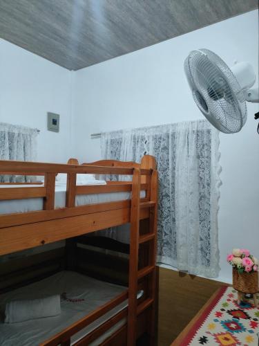 Una cama o camas en una habitación de Rustic Haven In Gabaldon Nueva Ecija
