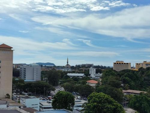 a cityscape of a city with buildings and a sky at Vetro11 Beside QEH1 by JUNE Homestay in Kota Kinabalu