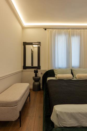a hotel room with two beds and a mirror at Private Premium Apartment in Plovdiv in Plovdiv