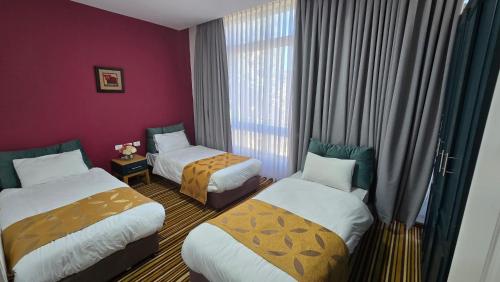 Postel nebo postele na pokoji v ubytování Jerusalem Boutique Hotel