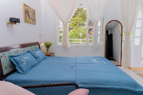 Кровать или кровати в номере Ichigo Home Đà Lạt
