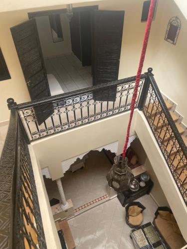 an overhead view of a spiral staircase with a stair at Riad Nour Resorts-Riad Nour Travel in Marrakech