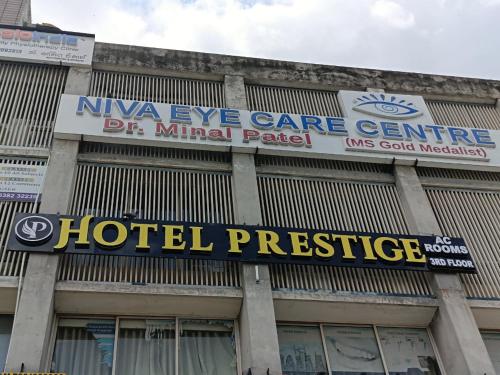 a hotelprise sign on the front of a building at Hotel Prestige in Ahmedabad
