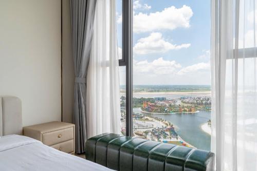a bedroom with a window with a view of a river at Vinhomes Grand Park - PDG Elegant Residence in Long Bình