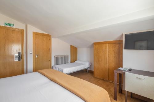 Ένα ή περισσότερα κρεβάτια σε δωμάτιο στο Hotel Rural Izar Ondo