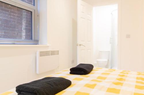 Ένα ή περισσότερα κρεβάτια σε δωμάτιο στο Radstock Road - Room 1a