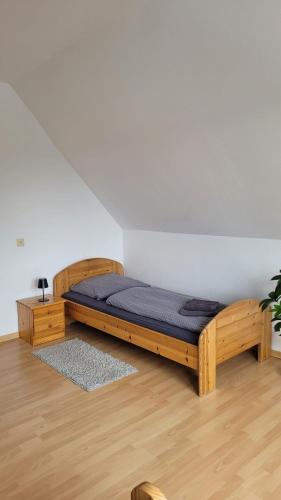 a bed in a room with a blue mattress at Ferienwohnung Gästehaus Bauer 2 in Heiligenhaus