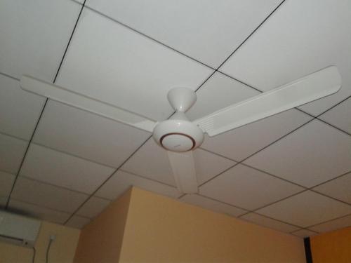 a ceiling fan with a light on a ceiling at Wild View Stay in Habarana