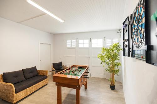 a living room with a foosball table at A Casa da Cascata in Ribeira Grande
