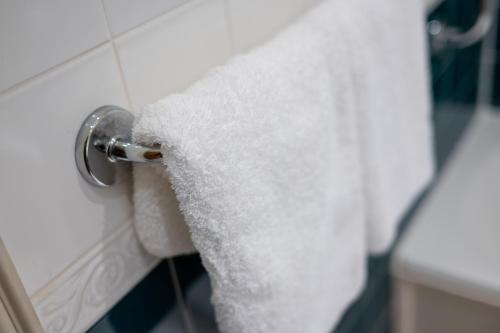 a roll of toilet paper hanging on a wall at The Open Arms Hotel in Dirleton
