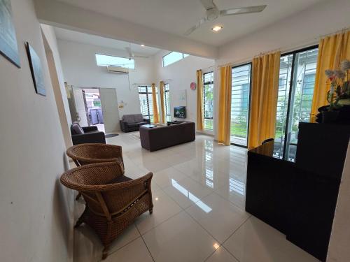 a living room with a couch and chairs and windows at Siantan In Paya Rumput Near Std Hang Jebat, Sg Udang & UITM Lendu in Melaka