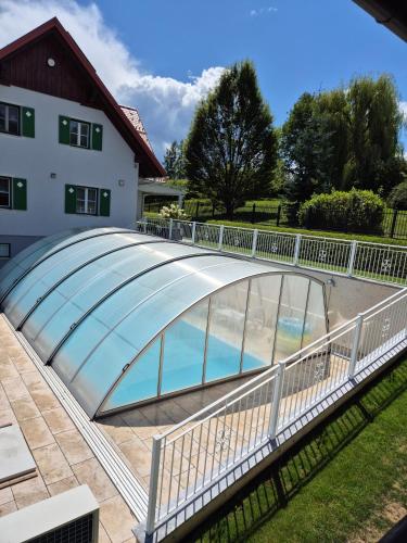 a glass bridge over a swimming pool at Ferienhaus Gertrud in Sankt Stefan ob Stainz