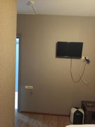 a room with a flat screen tv on a wall at Kavela555 in Tbilisi City