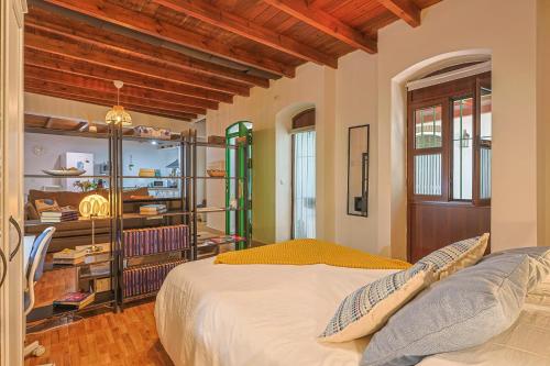 a bedroom with a bed and a wooden ceiling at Loft B2, Apartment in Seville in Seville