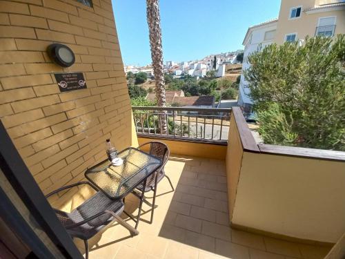 a small balcony with a table and chairs on a building at Dream Lagos B&B in Lagos