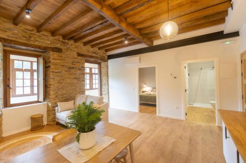 a living room with a couch and a table at Apartamentos Rurales Casa Carlota in Vegadeo