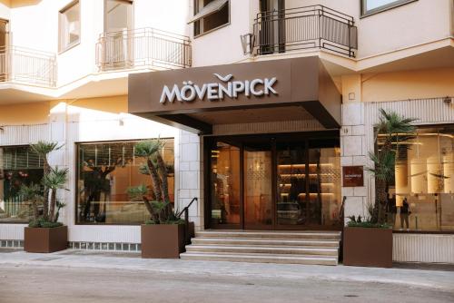 a building with a movemberrick sign on the front of it at Mövenpick Hotel Bari in Bari