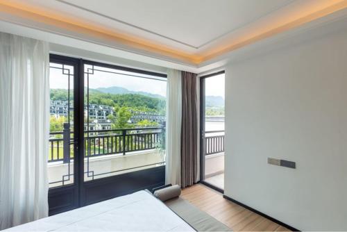 Postel nebo postele na pokoji v ubytování 隐序栖岚渡