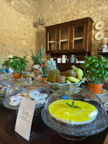 a table with several plates of food on it at Feudo Nobile in Gela