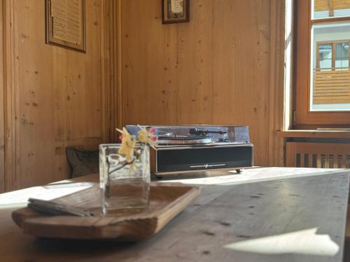 a table with a toaster sitting on top of a table at Piccolohotel Tempele Residence in San Candido