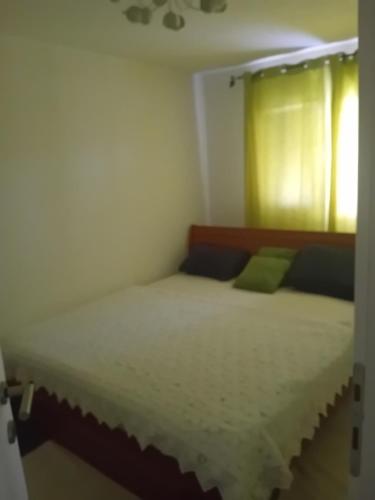 a bedroom with two beds and a window at MEDINA in Sarajevo