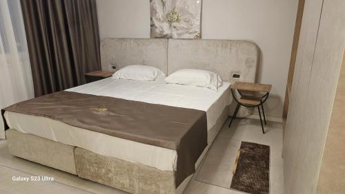 Ένα ή περισσότερα κρεβάτια σε δωμάτιο στο Nova Apartments Golem