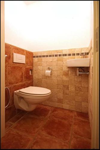 a bathroom with a toilet and a sink at Villa with garden near Amsterdam in Almere