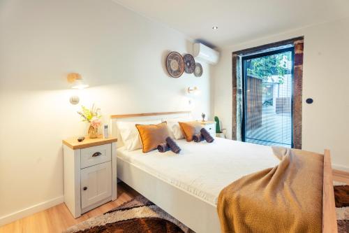Ένα ή περισσότερα κρεβάτια σε δωμάτιο στο House Porto Covelas - Avós