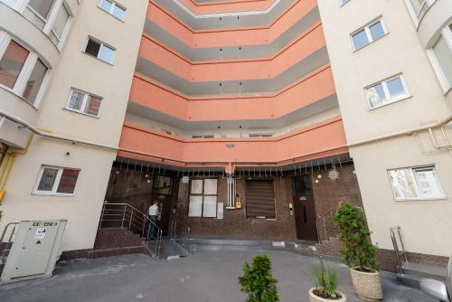 a man stands outside of a building at LuxRent in Chişinău