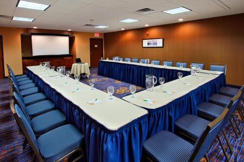 a conference room with a long table and chairs at Courtyard Rockaway-Mount Arlington in Mount Arlington