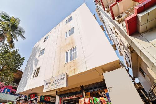 a building with a store in front of it at Hotel O Poddar Inn in Dispur