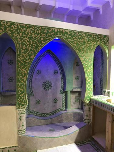 a room with a blue and green paint on a wall at Eden Suites 