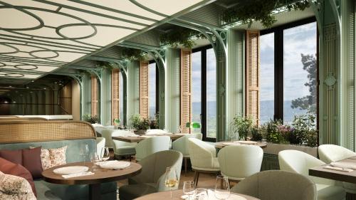 a restaurant with tables and chairs and windows at Jakobsberg Nature Resort in Boppard
