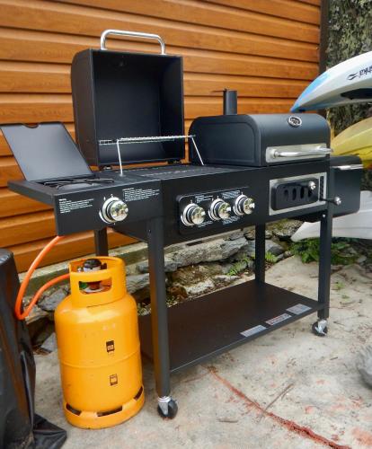 a bbq grill with a laptop on it at Adrigole Bay Studio Apartment in Adrigole