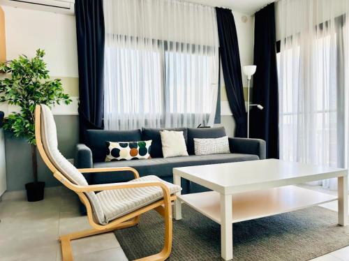 Terra Apartments in Caesar Blue Resort, Fixed Lunch till 3pm, Gym, Heated pool, Sauna, Kids clubにあるシーティングエリア
