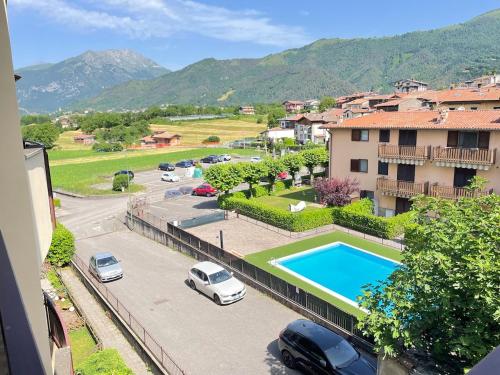 a view of a parking lot with a swimming pool at Maison della Presolana in Songavazzo