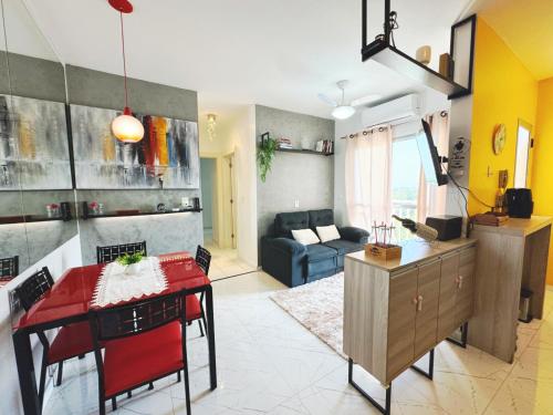 a living room with a table and a couch at Apartamento Belem Cop30 proximo ao aeroporto #belem #Cop 30 #aeroporto in Belém