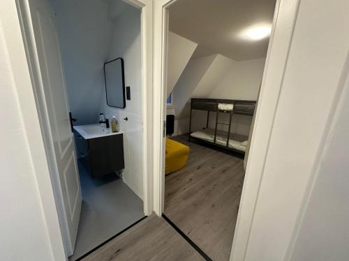 a hallway leading to a room with a bed at Marmus in Pfaffenhoffen