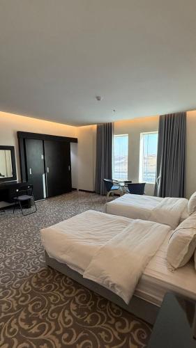 Ένα ή περισσότερα κρεβάτια σε δωμάτιο στο MBN ARTAMA Hotel